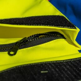 Kruedener Hundef&uuml;hrer-/ Durchgehjacke warnrot/blau/gelb Funktasche herzseitig 36/38